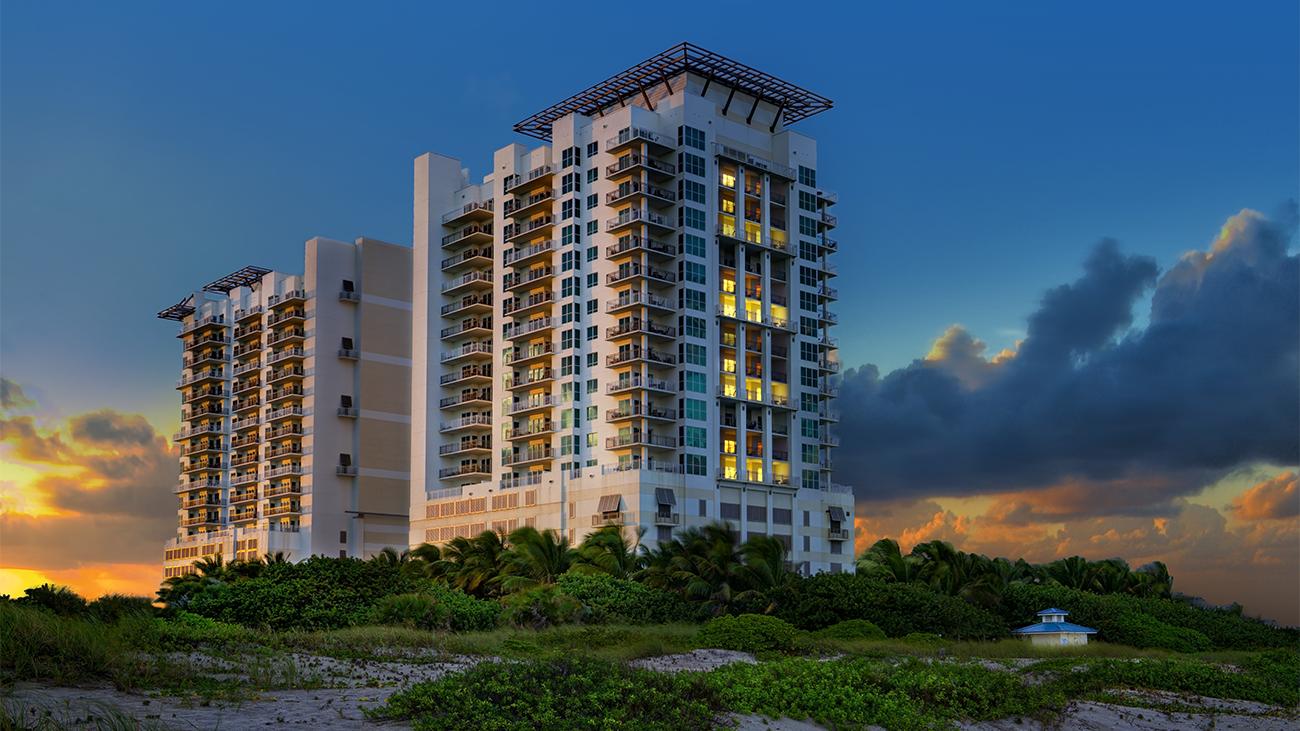 Exterior of Marriott's Oceana Palms timeshare resort amid natural beach dunes